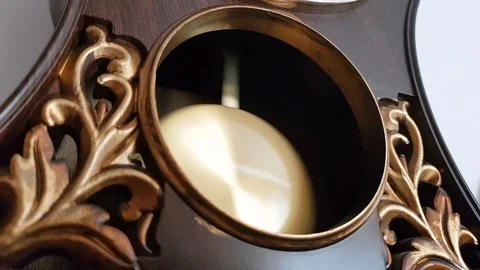 The pendulum of the old clock swings Stock Footage 112343195