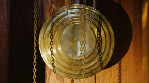 The pendulum of the old clock swings from side to side Stock Footage 106571328