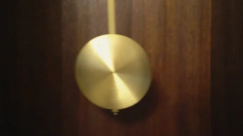 Pendulum Swinging Inside Dark Wooden Case Clock Stock Footage 153593403