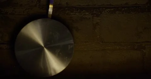 Pendulum symbol of the passage of time close-up  4k, video Stock Footage 305996062