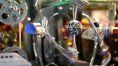 Pendulum. A system that is suspended in a gravitational field and performs me Stock Footage 89757224