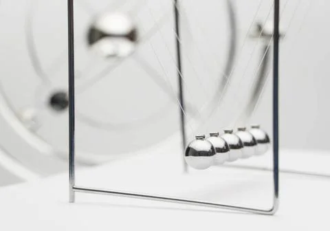 Pendulum on a white background balancing balls on a white background. busi... Stock Photos