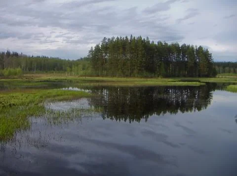 The peninsula is reflected in the river Stock Photos