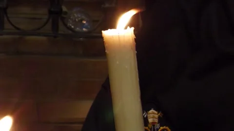 Penitent Fixing Candle Wax During Semana Santa in Seville Stock Footage 336007688