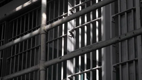 Penitentiary prison gaol jail cell iron bars correctional center B-roll Vidéo 121655191