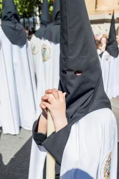 Penitents in procession. Stock Photos