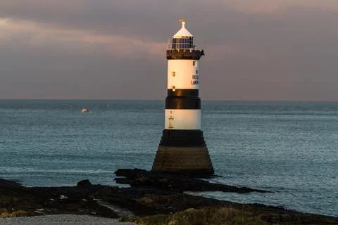 Penmon, pen Mon Lighthouse at sunset, centred, Stock Photos