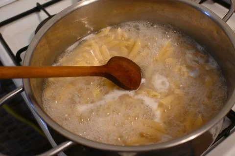 Penne pasta boiling in a pot Stockfoto's