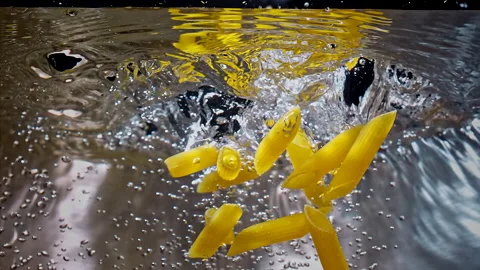 Penne Pasta Falling Down in to the pot Super Slow motion 1000fps  Stock Footage 130900024