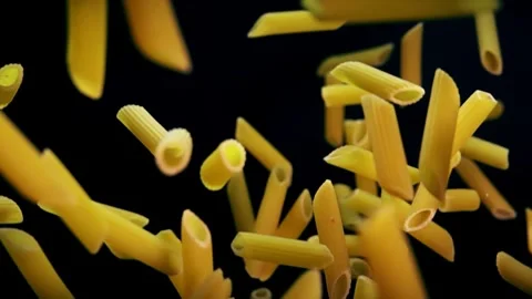 Penne Pasta Falling in Slow Motion Against a Dark Background Stock Footage 272189091