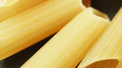 Penne pasta tubes macro close up presentation slowly rotating stock footage Stock Footage 344860383