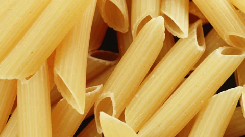 Penne pasta tubes macro close up presentation slowly rotating stock footage Stock Footage 344861631