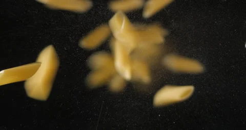Penne pastas falling from below, slowmotion low angle 4K pro res Stock-Footage 275897778
