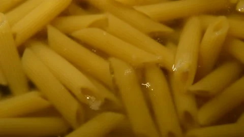 Penne rigate pasta is being prepared Видео 312378611
