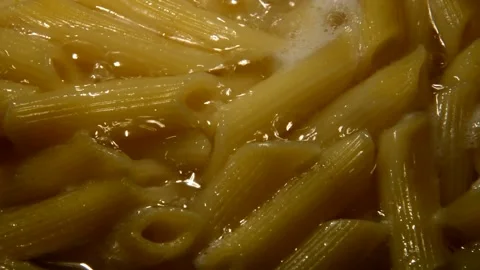 Penne rigate pasta is being prepared Видео 312378939