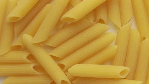 Penne rigate on a rotating plate 스톡 동영상 149380415