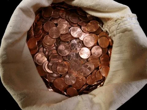 Pennies in a sack Stock Photos