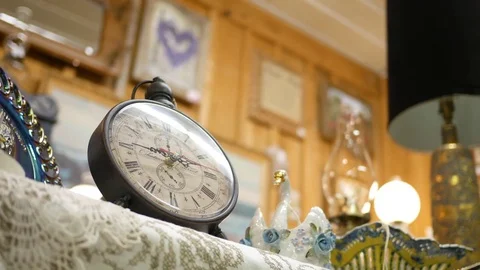 PENNSYLVANIA - Circa October 2017 - A small clock resting in an antique store Stock Footage 81111311