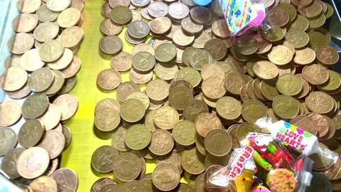 Penny falls machine in the arcade Stock Footage 238354388