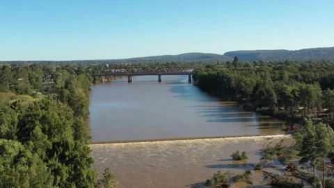 Penrith Weir on Nepean River below two Bridges – yellow water in 4k. Stock Footage 151657370
