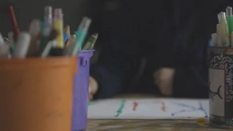 Pens in a container with children doing activities in the background. Stock Footage 281564717