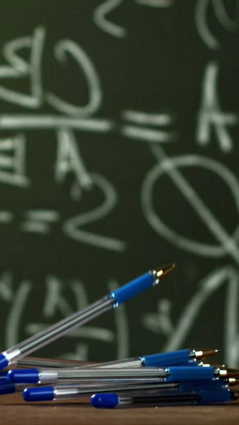 Pens fall on the school desk. Filmed on a high-speed camera at 1000 fps Stock Footage 335373012