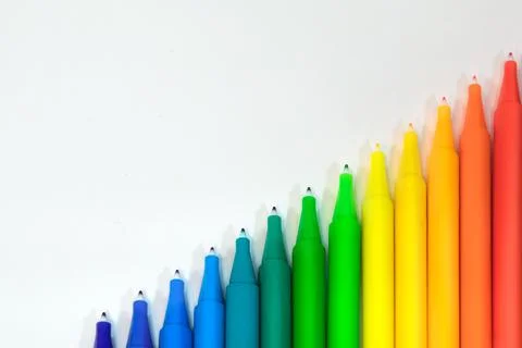 Pens stacked sequentially on a white surface. Great for backgrounds Stock Photos