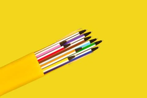 Pens in a yellow box Stock Photos