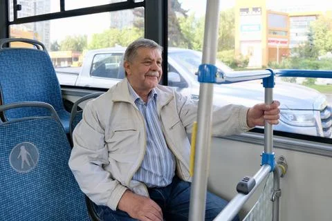 A pensioner on a bus	 Stock Photos