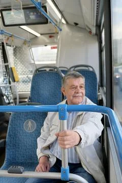 A pensioner on a bus	 Stock Photos