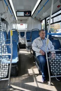 A pensioner on a bus	 Stock Photos