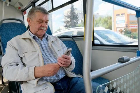 A pensioner on a bus	 Stock Photos