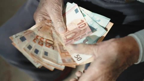 Pensioner in despair counting his miserable pension income, poverty concept Stock Footage 170463649