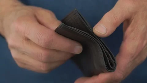 Pensioner hands open black empty wallet looking for money Stock Footage 133682833