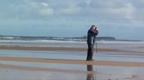 Pensioner OAP on beach Stock Footage 12179470