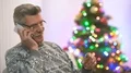 The pensioner phone near the christmas tree 4k or 4k+ Resolution