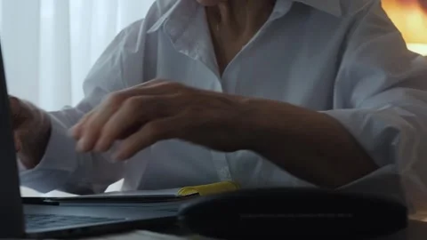 A pensioner types on a computer keyboard. Stock Footage 242141287