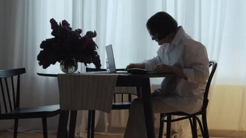 A pensioner types on a computer keyboard. Stock Footage 242141504