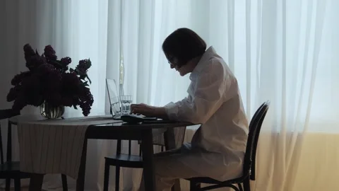 A pensioner types on a computer keyboard. Stock Footage 242141505
