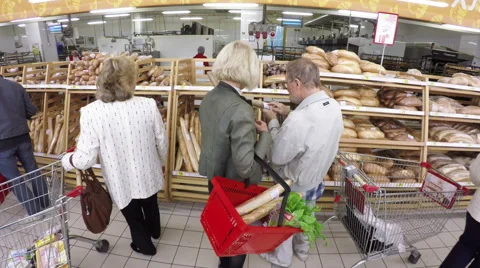 Pensioners are choosing bread at the store Video stock 55911490