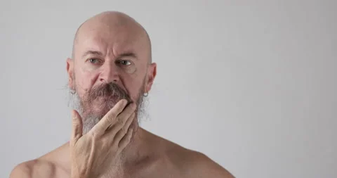 Pensive 50 year old man with long beard portrait Stock Footage 165885893