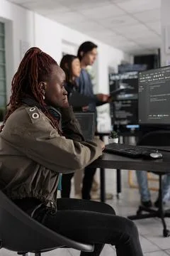 Pensive african american app developer programming code development 写真素材