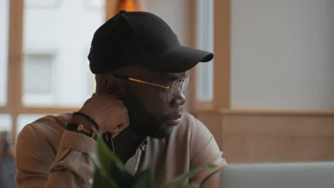 Pensive African American man in glasses and cap. Stock Footage 268987953