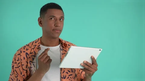 Pensive african american man using tablet Video stock 197084610