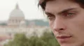 pensive and sad young man ,have tears in his eyes - saint peter in background HD Footage