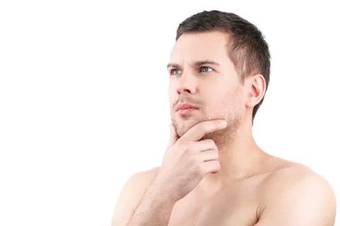 Pensive attractive guy is posing confidently Stock Photos