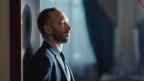 Pensive bearded male thinking having business problem. Shot on RED Raven 4k Stock Footage 124525142