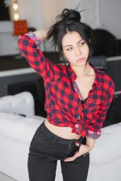 Pensive brunette posing in a studio. Stock Photos