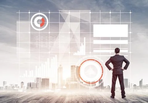 Pensive businessman looking at user interface against modern cit Foto stock