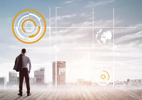 Pensive businessman looking at user interface against modern city background 스톡 사진